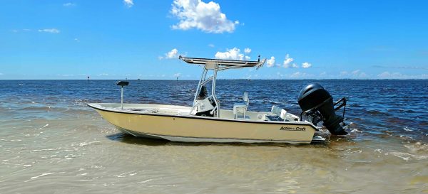 bay boat beached on shore, action craft 22 coastal bay