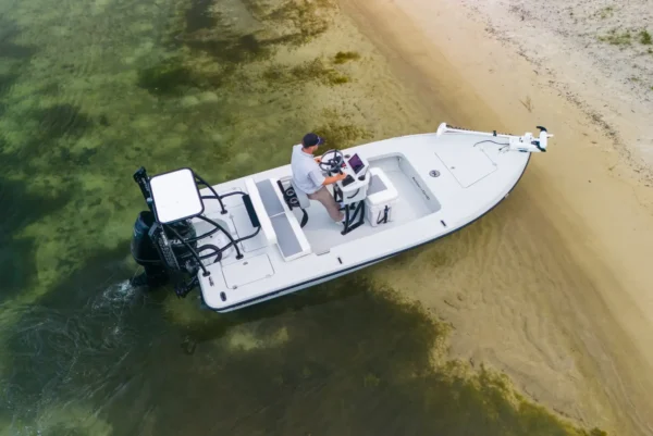 flats boat beached, action craft 17 flyfisher